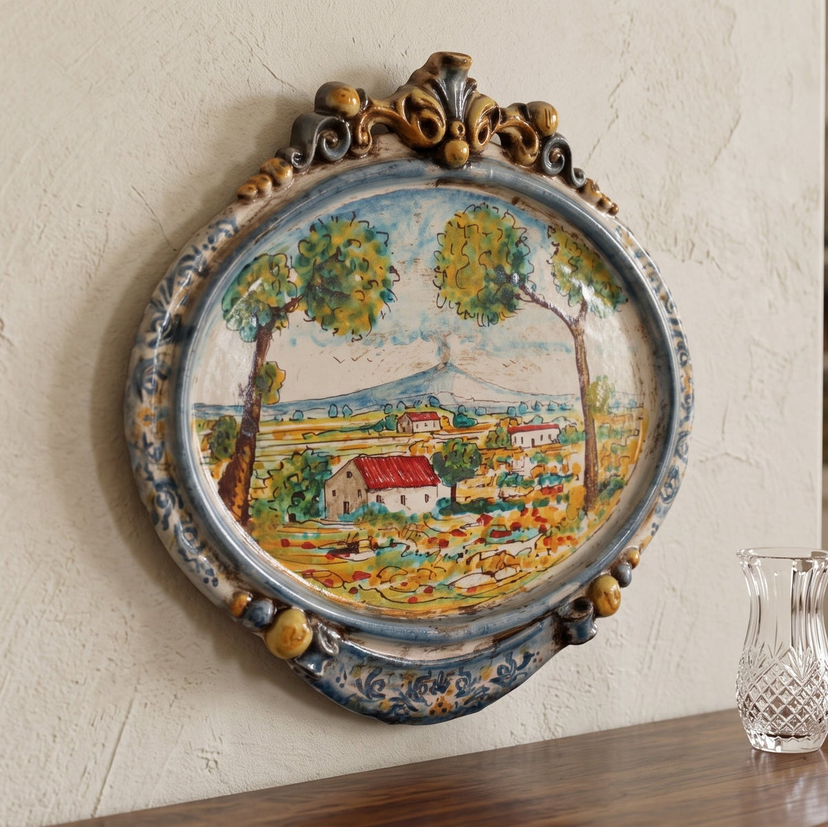 Sicilian Oval Wall Plaque 23×25 cm / 9×9¾", Sicilian Landscape, Blue and Orange – Sicilian majolica handcrafted in Caltagirone