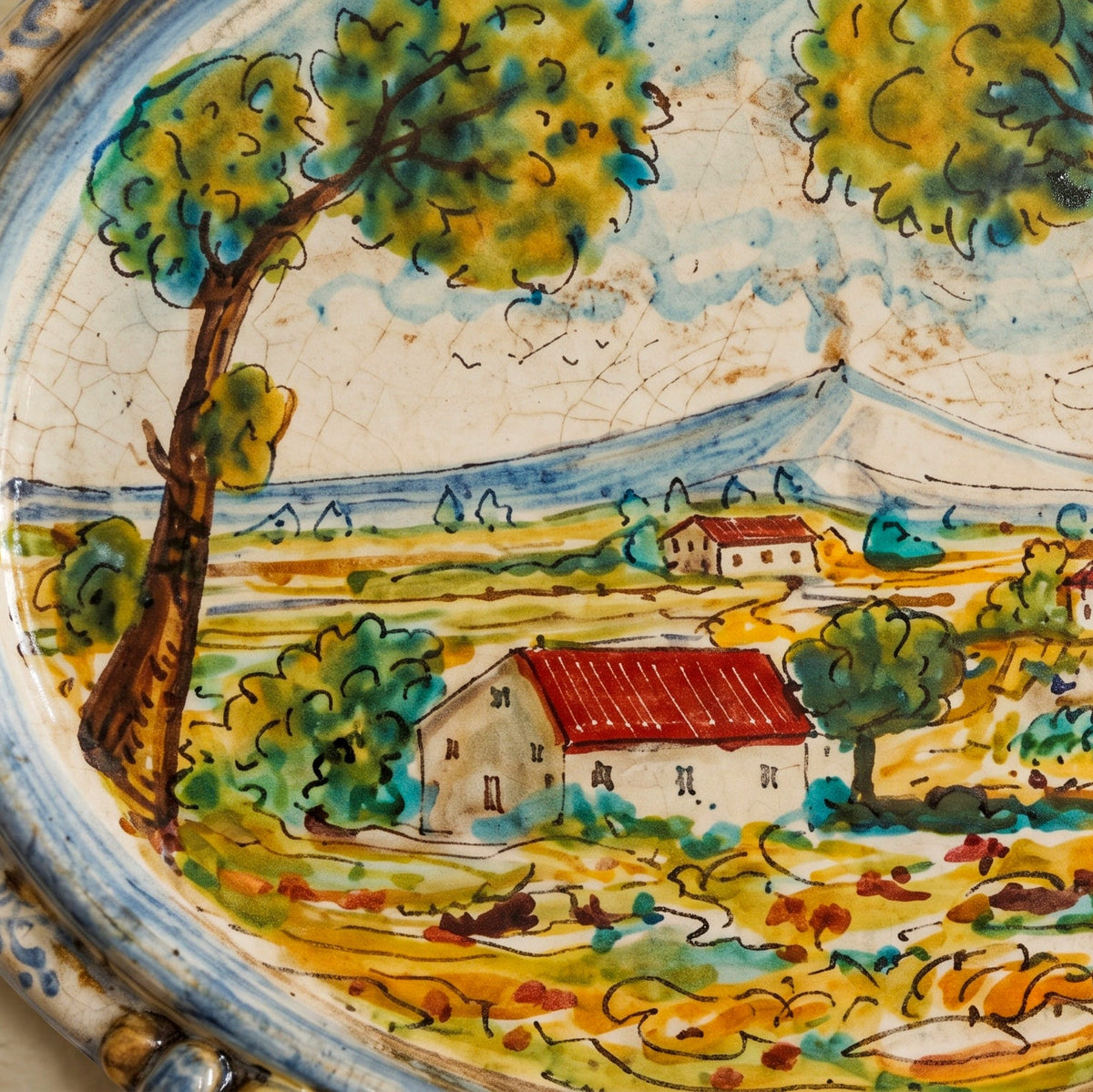 Sicilian Oval Wall Plaque 23×25 cm / 9×9¾", Sicilian Landscape, Blue and Orange – Sicilian majolica handcrafted in Caltagirone