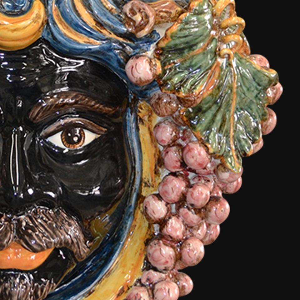 Testa di moro ceramica di Caltagirone fatta a mano con uva blu e arancio dettagliati