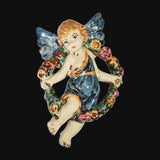 Angelo in ceramica di Caltagirone fatto a mano con ali blu e ghirlanda floreale