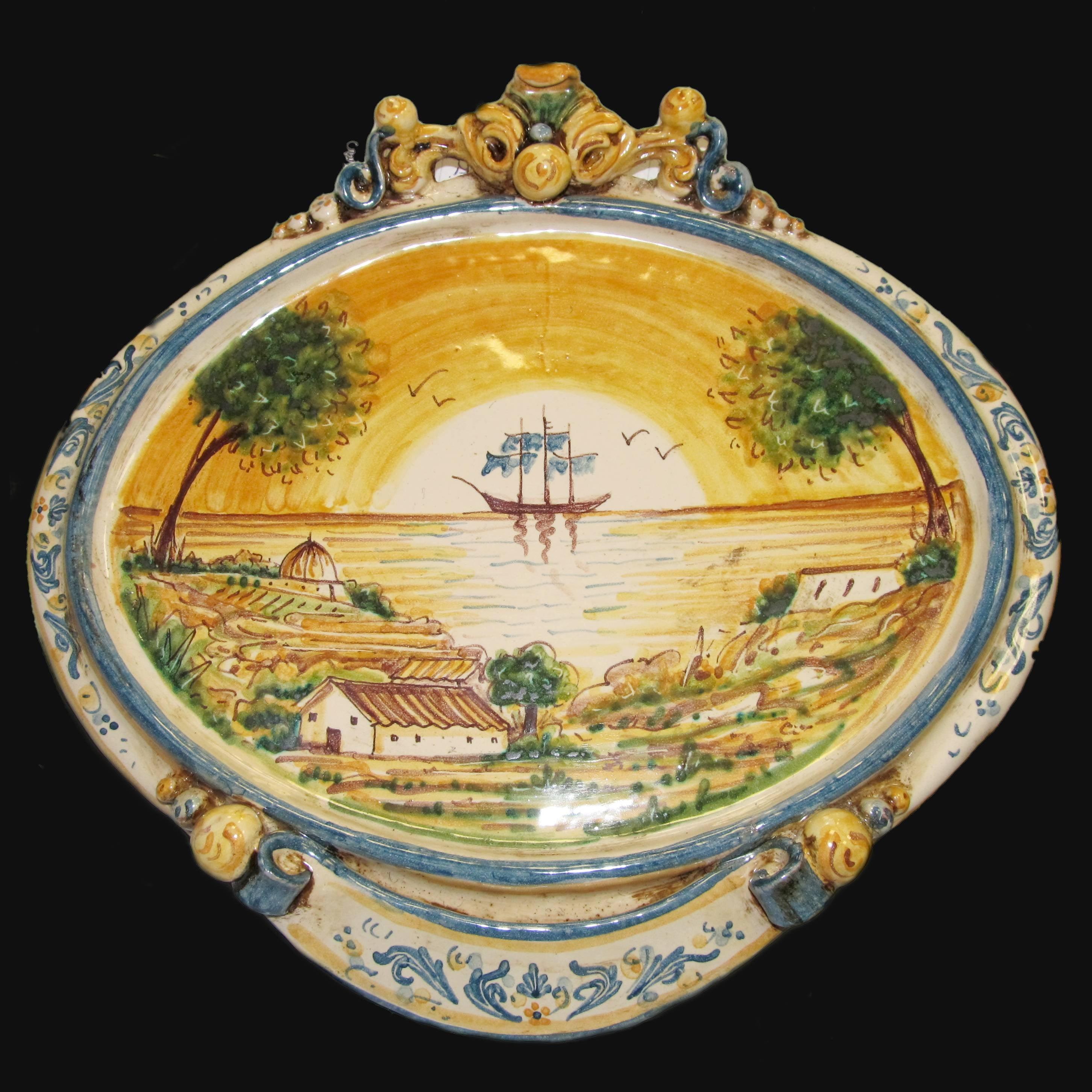 Ovale orizzontale medio c/veliero 23x25 blu/arancio in Ceramica Artistica di Caltagirone